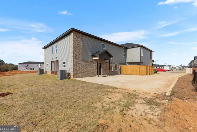 a view of parking space with a house