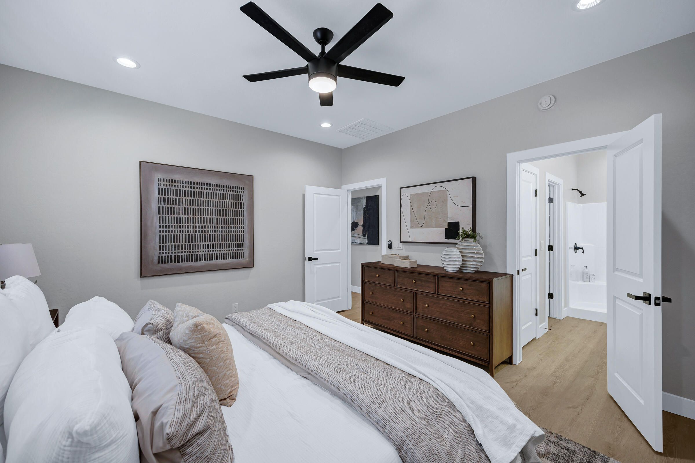 1105 East Frontier Street Payson, AZ 85541 - Photo 21 of 26 a bedroom with a bed and a chandelier