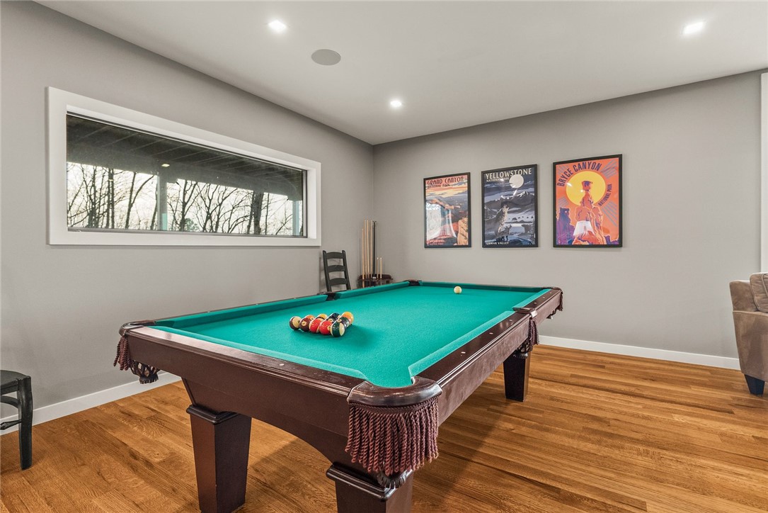 2623 Alum Cave Road Bee Branch, AR 72013 - Photo 48 of 60 Recreation room featuring hardwood flooring, recessed lighting, a horizontal window, and neutral wall paint