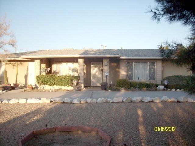 15901 Venango Road Apple Valley, CA 92307 - Photo 1 of 1 a view of a house with a patio
