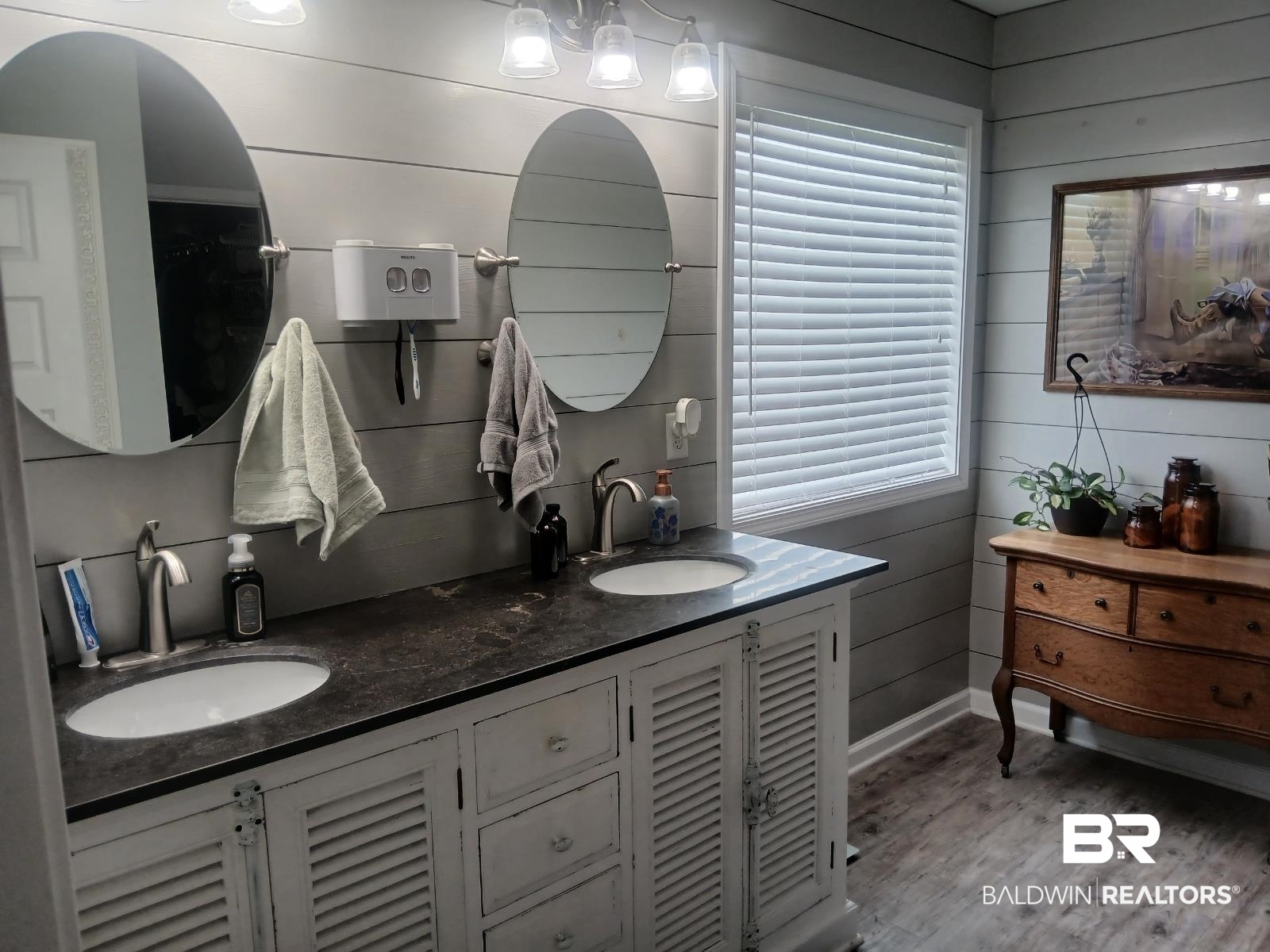17431 Harding Drive Foley, AL 36535 - Photo 8 of 24 Bathroom featuring hardwood / wood-style floors, a healthy amount of sunlight, double sink vanity, and wooden walls