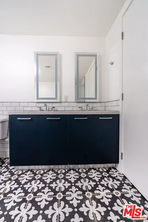 a kitchen with a sink and large window