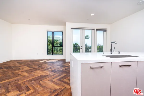 a bathroom with a sink mirror and window