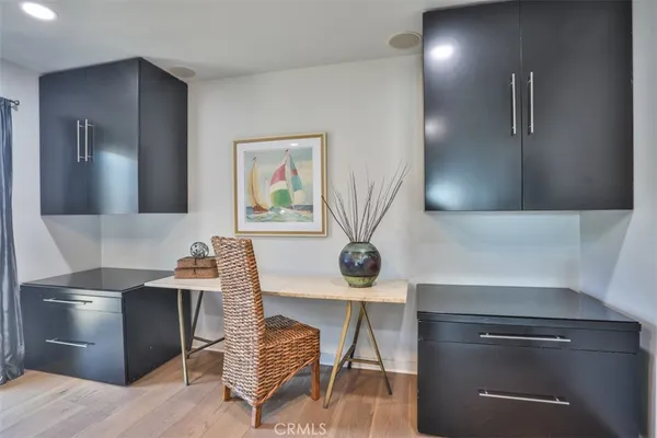 a kitchen with granite countertop a sink and a stove