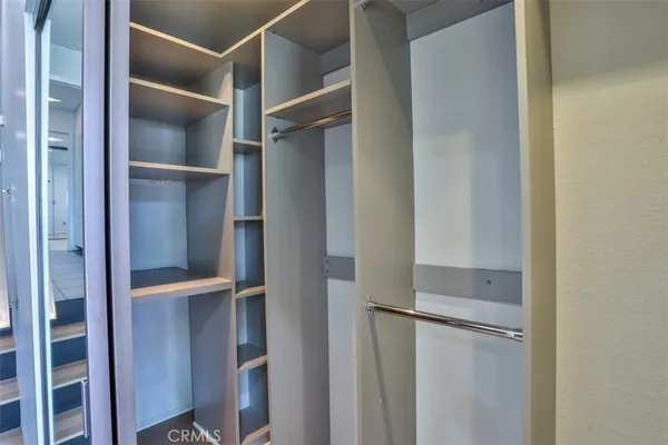 a front view of a house with a yard and a fountain