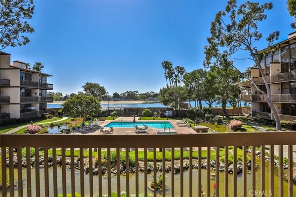 a swimming pool with outdoor seating and yard