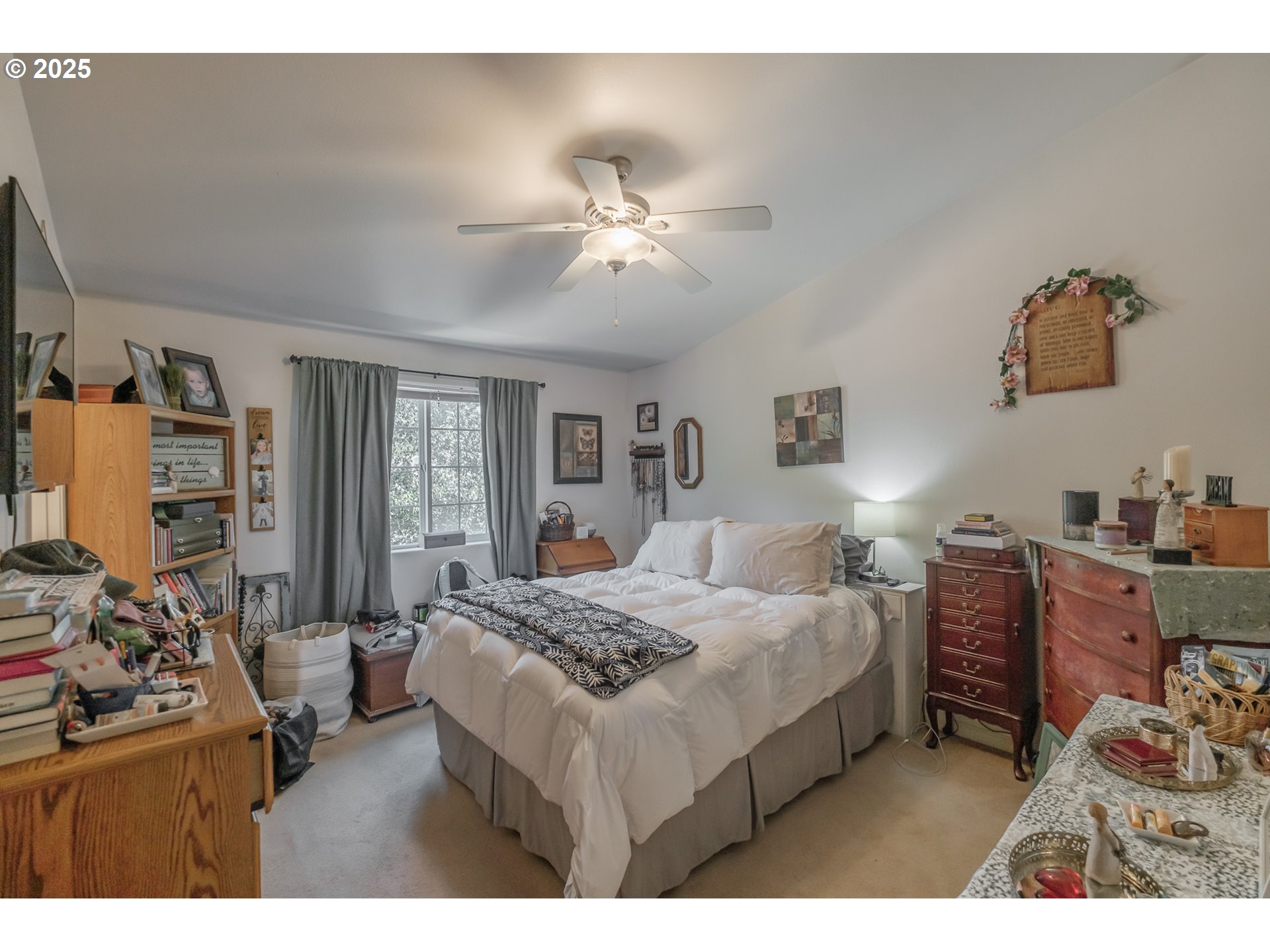 1036 9th Street Florence, OR 97439 - Photo 30 of 47 a bedroom with a bed and a chandelier