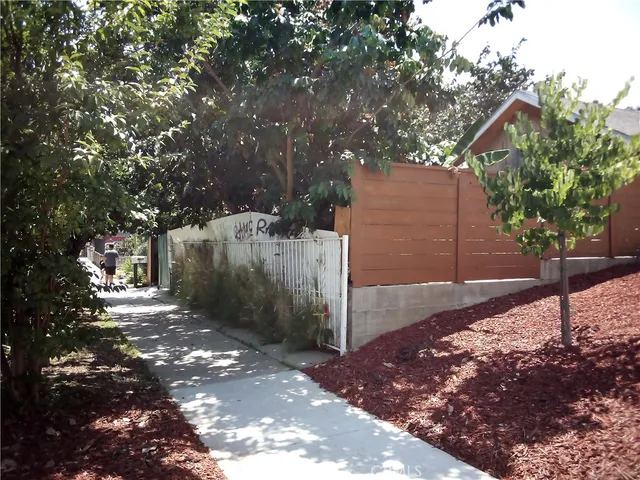 a backyard of a house with lots of green space