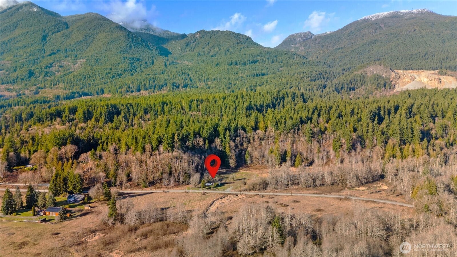 38425 Swede Heaven Road Arlington, WA 98223 - Photo 34 of 36 a view of a road with a barn in the background