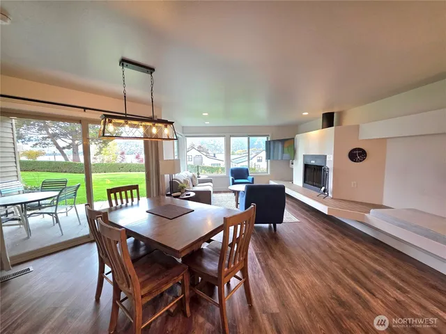 a view of a dining room with furniture window and outside view