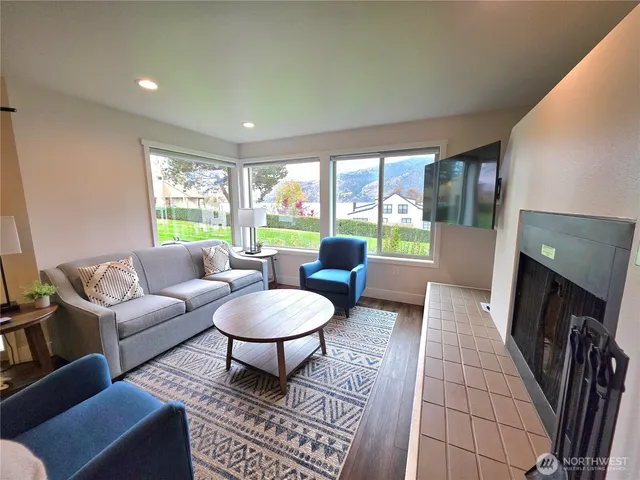 a living room with furniture and a flat screen tv