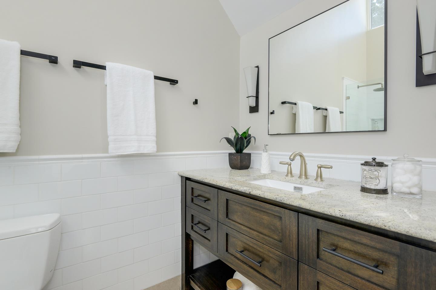 7 Farm Road Los Altos, CA 94024 - Photo 14 of 38 a bathroom with a granite countertop sink and a mirror