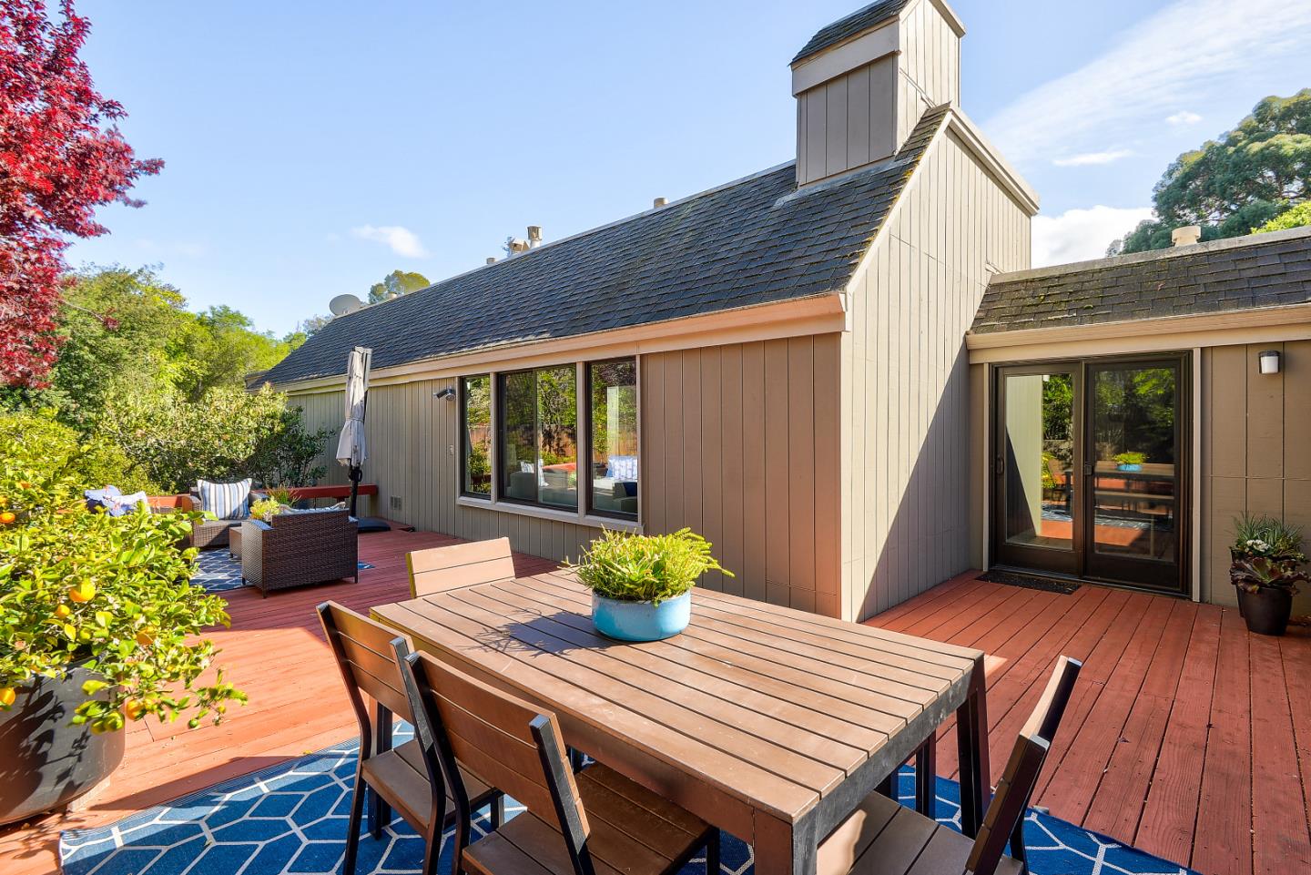 7 Farm Road Los Altos, CA 94024 - Photo 22 of 38 a view of a dining table and chairs in patio of the house