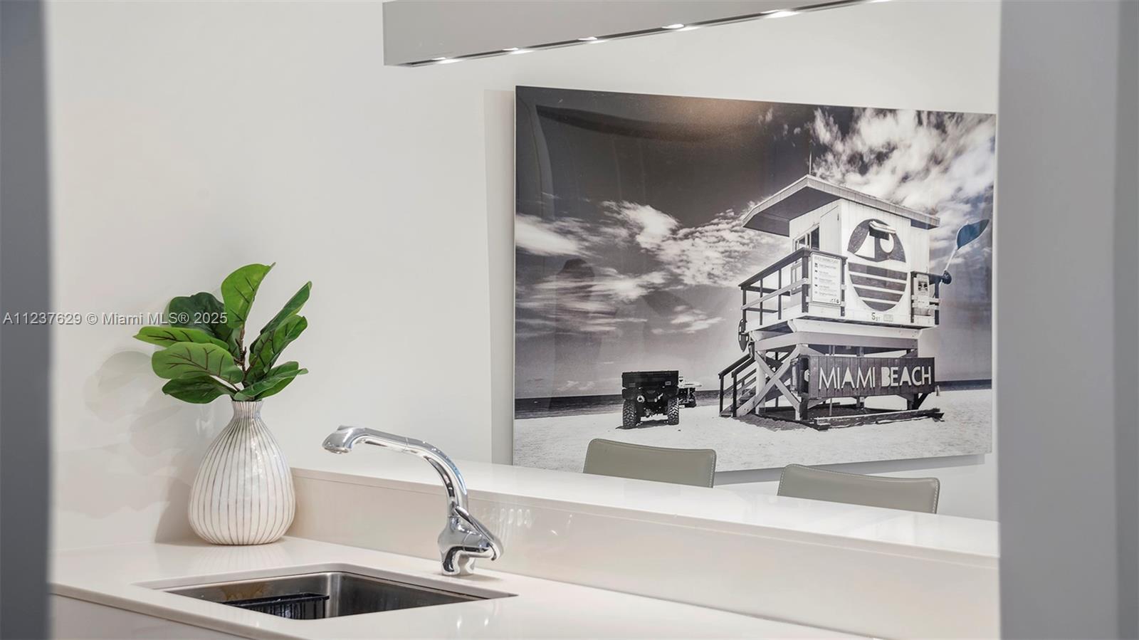 2201 Collins Avenue, Unit 804 Miami Beach, FL 33139 - Photo 13 of 41 a closeup of a sink and a mirror