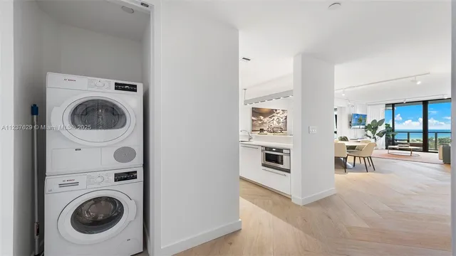 a view of a kitchen with washer and dryer