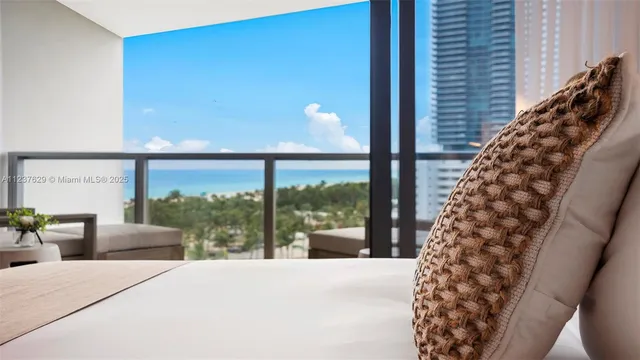 a bedroom with a bed and a night stand