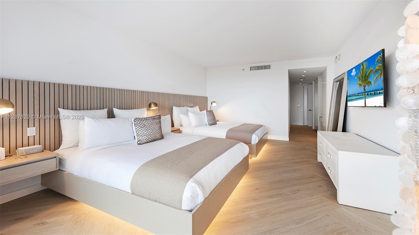 2201 Collins Avenue, Unit 804 Miami Beach, FL 33139 - Photo 24 of 41 a bed room with a bed and a couch