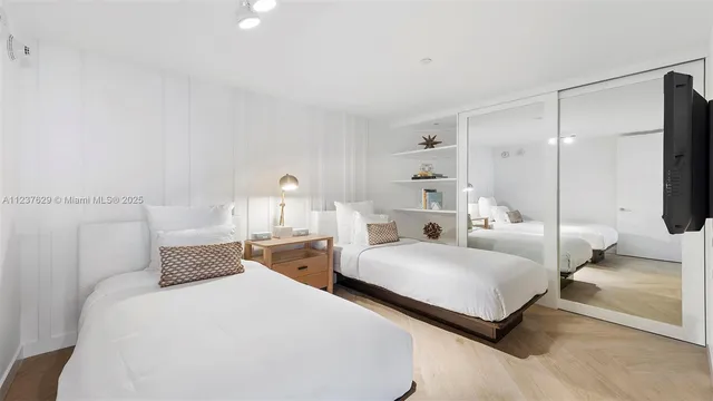 a bedroom with a bed and a lamp