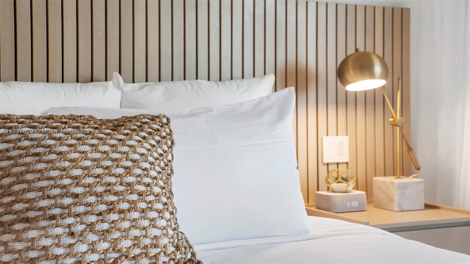 2201 Collins Avenue, Unit 804 Miami Beach, FL 33139 - Photo 38 of 41 a bathroom with a bathtub and a shower curtain