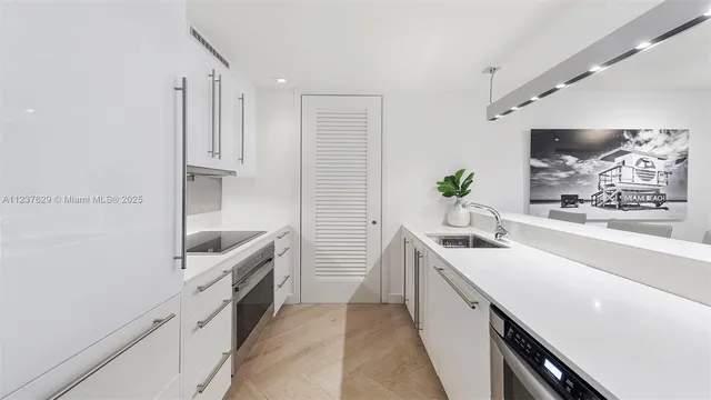 a kitchen with a sink and cabinets
