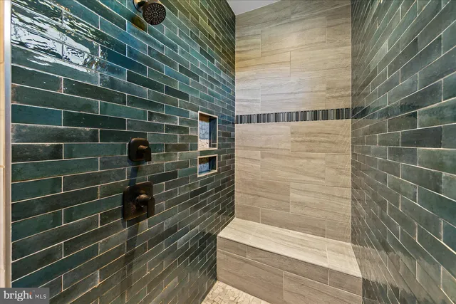 a view of a house with a yard and a large tree