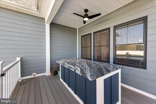 an aerial view of a house with a yard and lake view