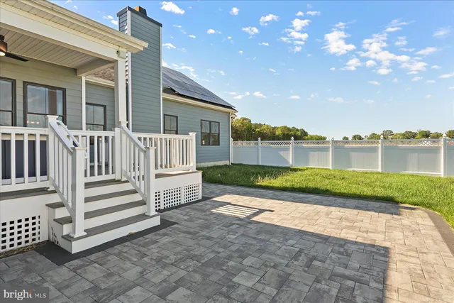 a view of yard with swimming pool and green yard
