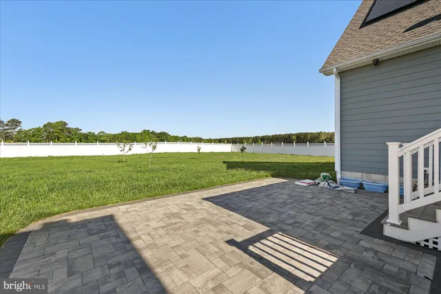 a view of a backyard with a lake view