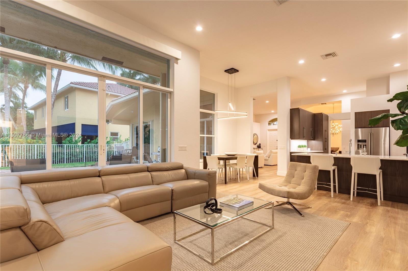 1655 Victoria Pointe Circle Weston, FL 33327 - Photo 13 of 43 a living room with furniture and a large window