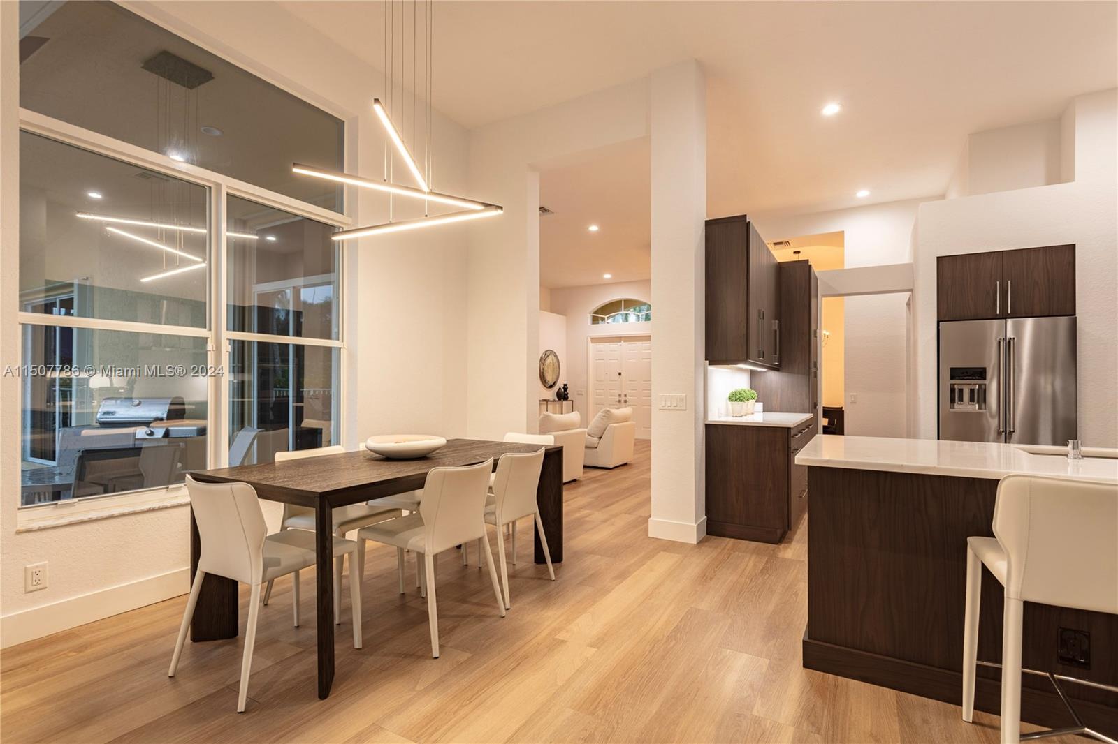 1655 Victoria Pointe Circle Weston, FL 33327 - Photo 14 of 43 a dining room with furniture and window