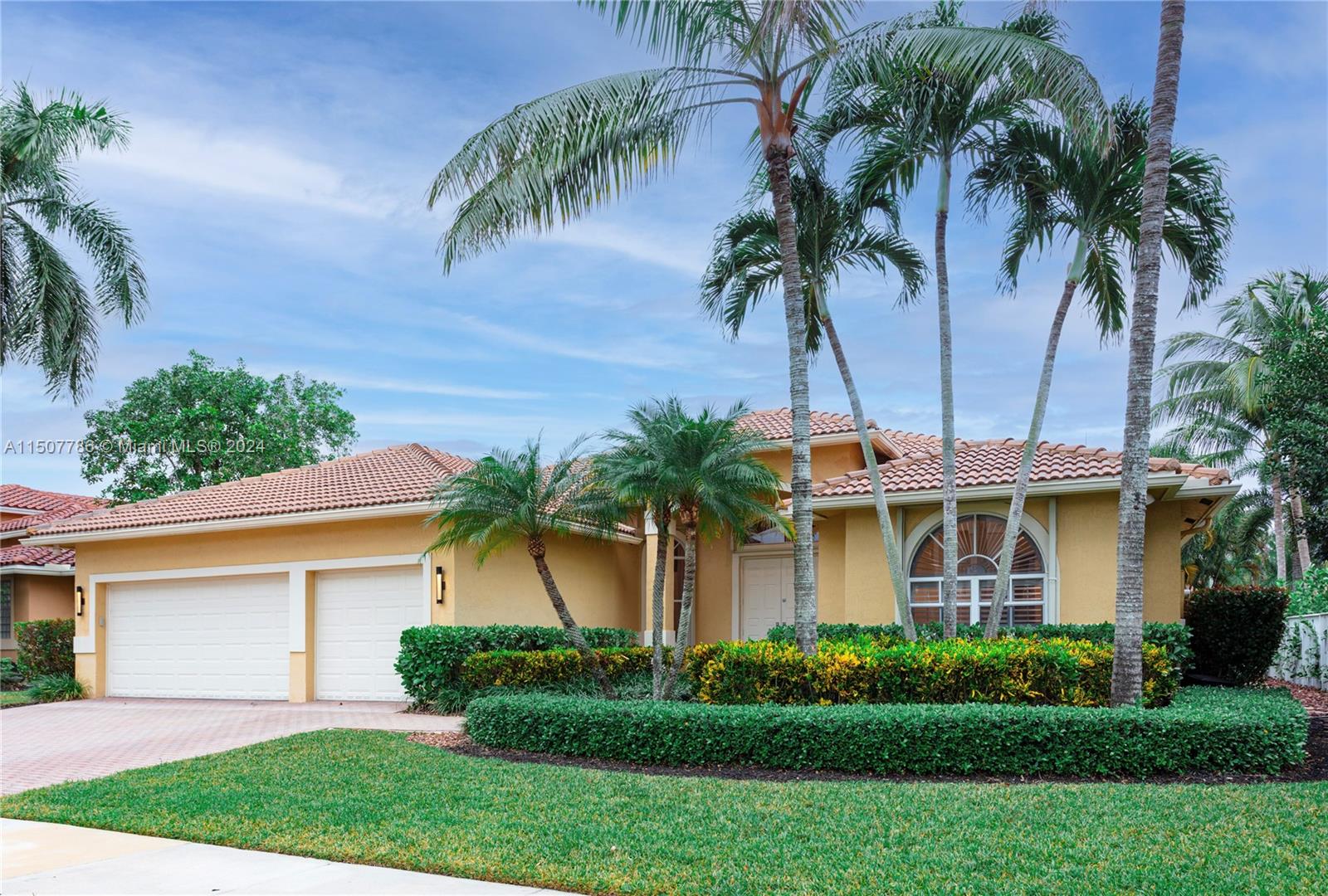 1655 Victoria Pointe Circle Weston, FL 33327 - Photo 2 of 43 a front view of house with yard and green space
