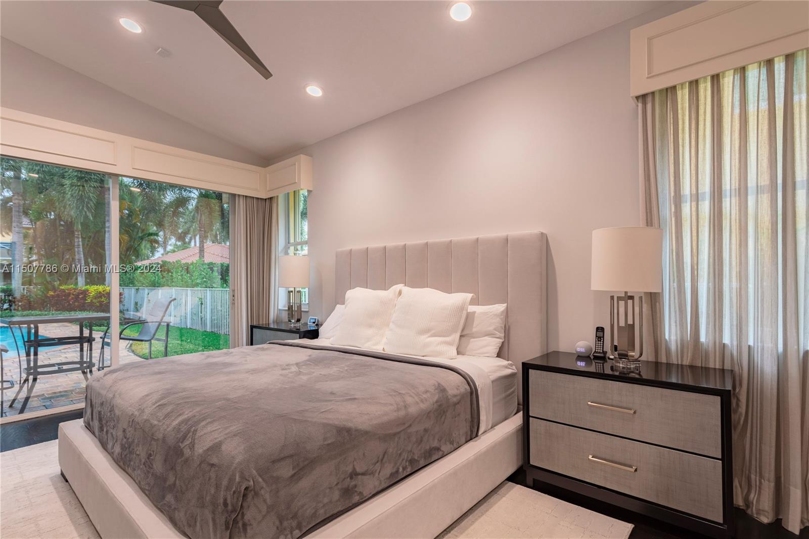 1655 Victoria Pointe Circle Weston, FL 33327 - Photo 21 of 43 a bed sitting in a spacious bedroom next to a window