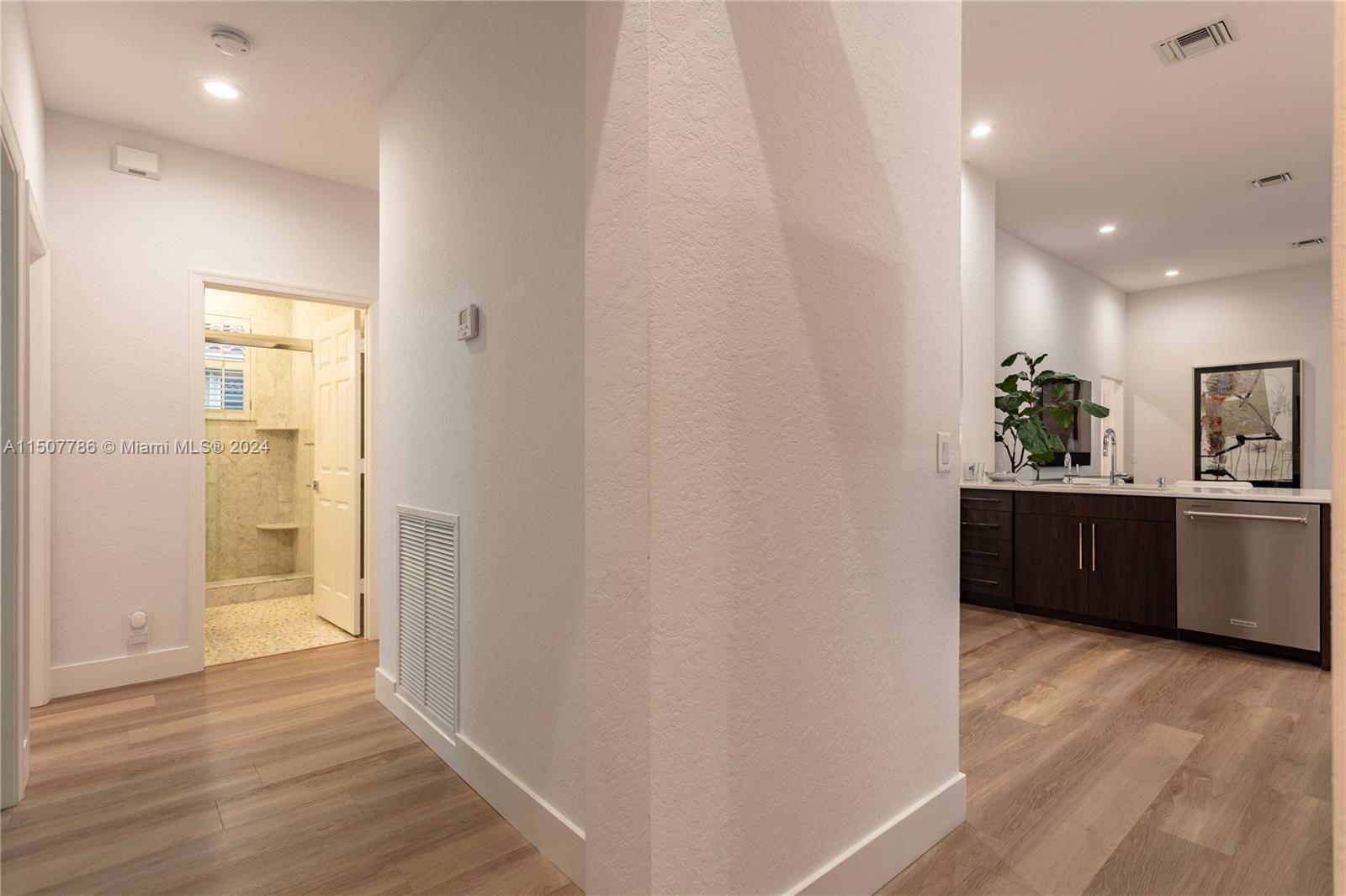 1655 Victoria Pointe Circle Weston, FL 33327 - Photo 27 of 43 a view of a hallway with wooden floor