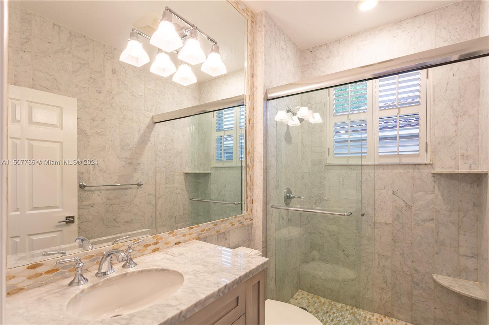 1655 Victoria Pointe Circle Weston, FL 33327 - Photo 28 of 43 a bathroom with a granite countertop sink toilet and shower