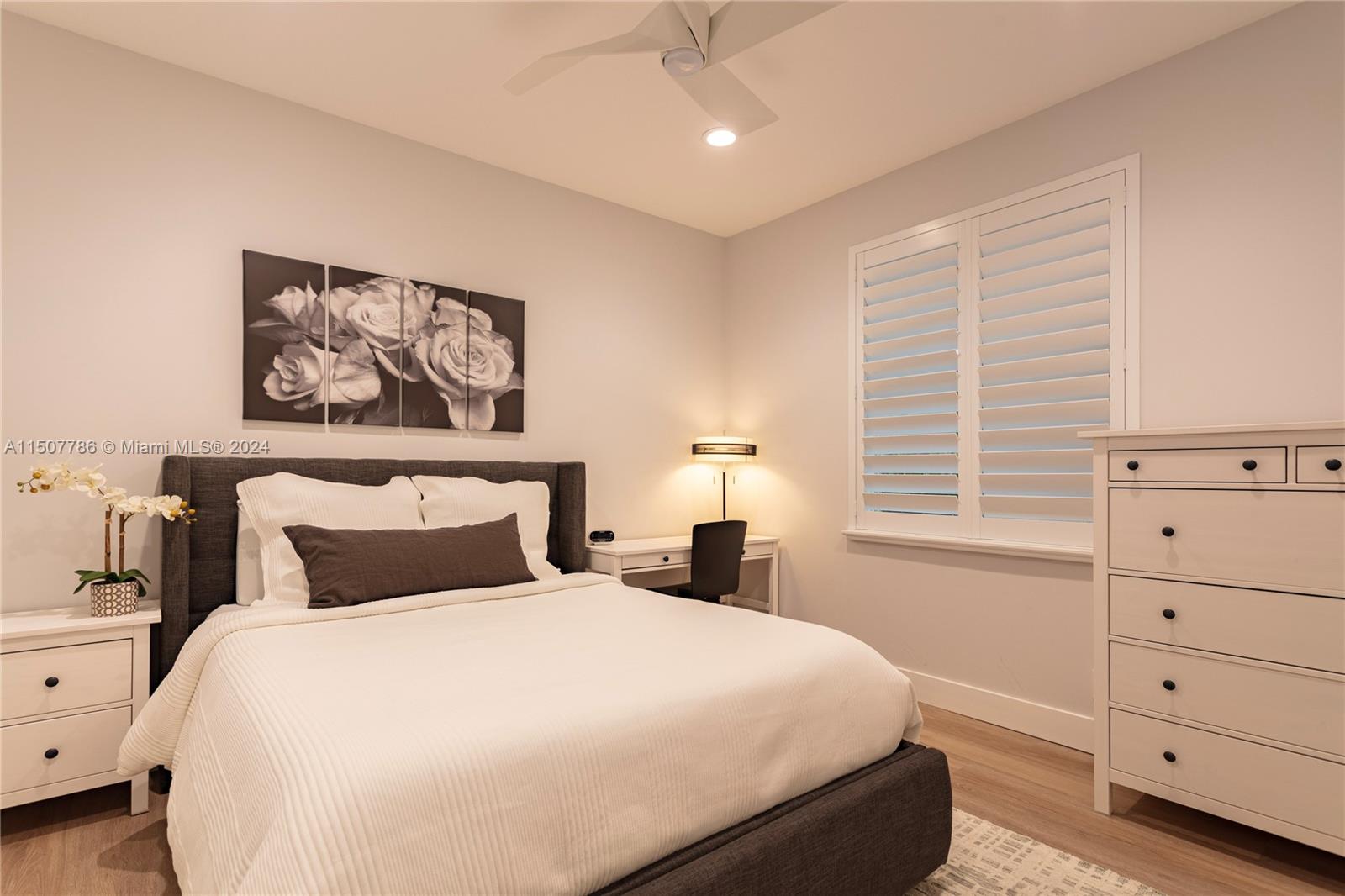 1655 Victoria Pointe Circle Weston, FL 33327 - Photo 30 of 43 a bedroom with a bed and a window