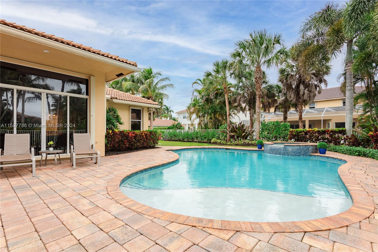 1655 Victoria Pointe Circle Weston, FL 33327 - Photo 3 of 43 a view of a house with swimming pool and sitting area
