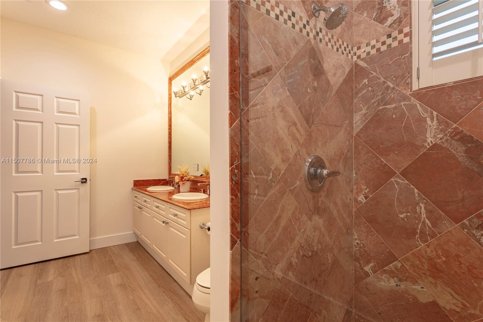 1655 Victoria Pointe Circle Weston, FL 33327 - Photo 39 of 43 a bathroom with a sink and a mirror