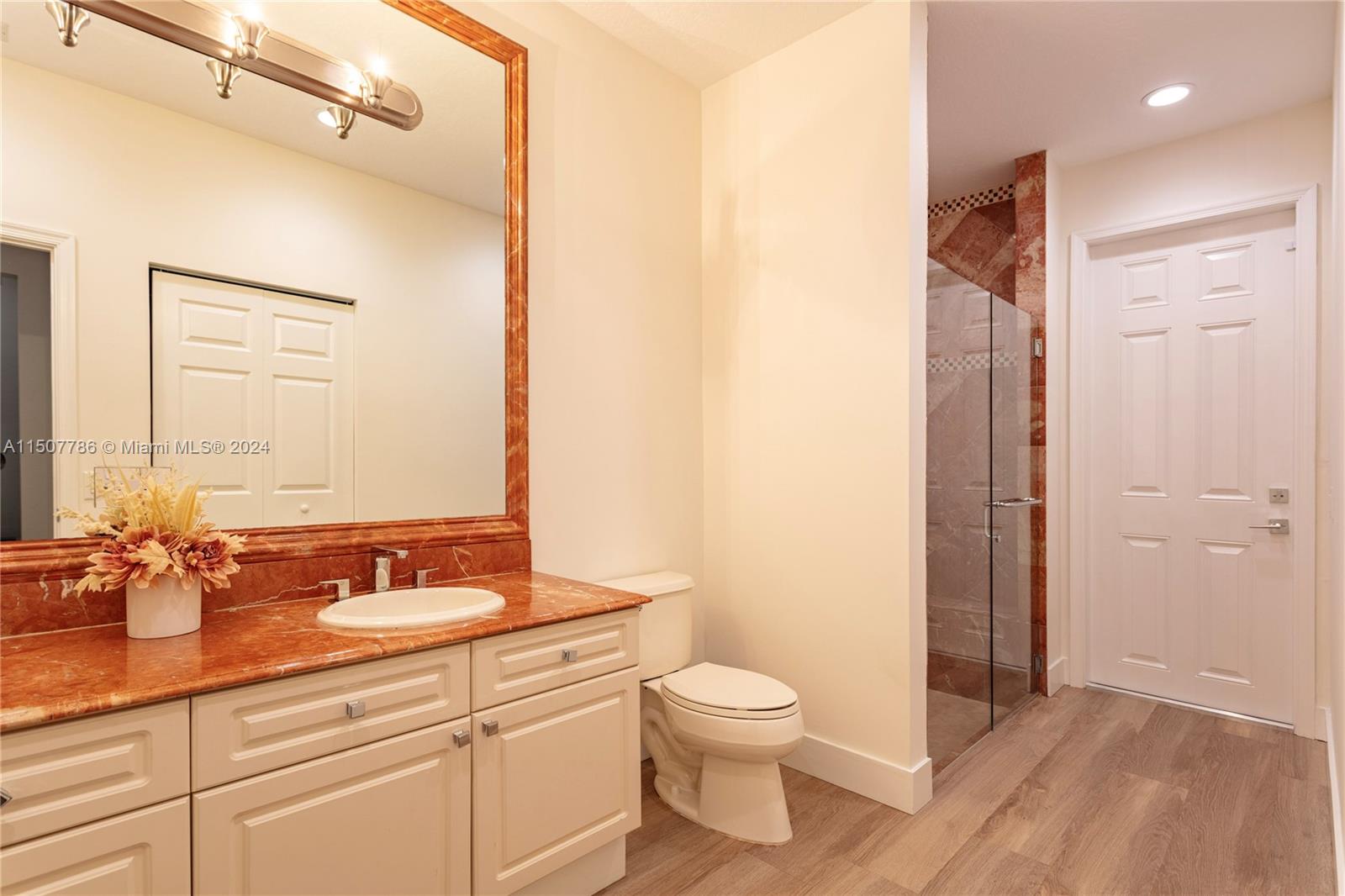 1655 Victoria Pointe Circle Weston, FL 33327 - Photo 40 of 43 a bathroom with a sink a toilet and shower