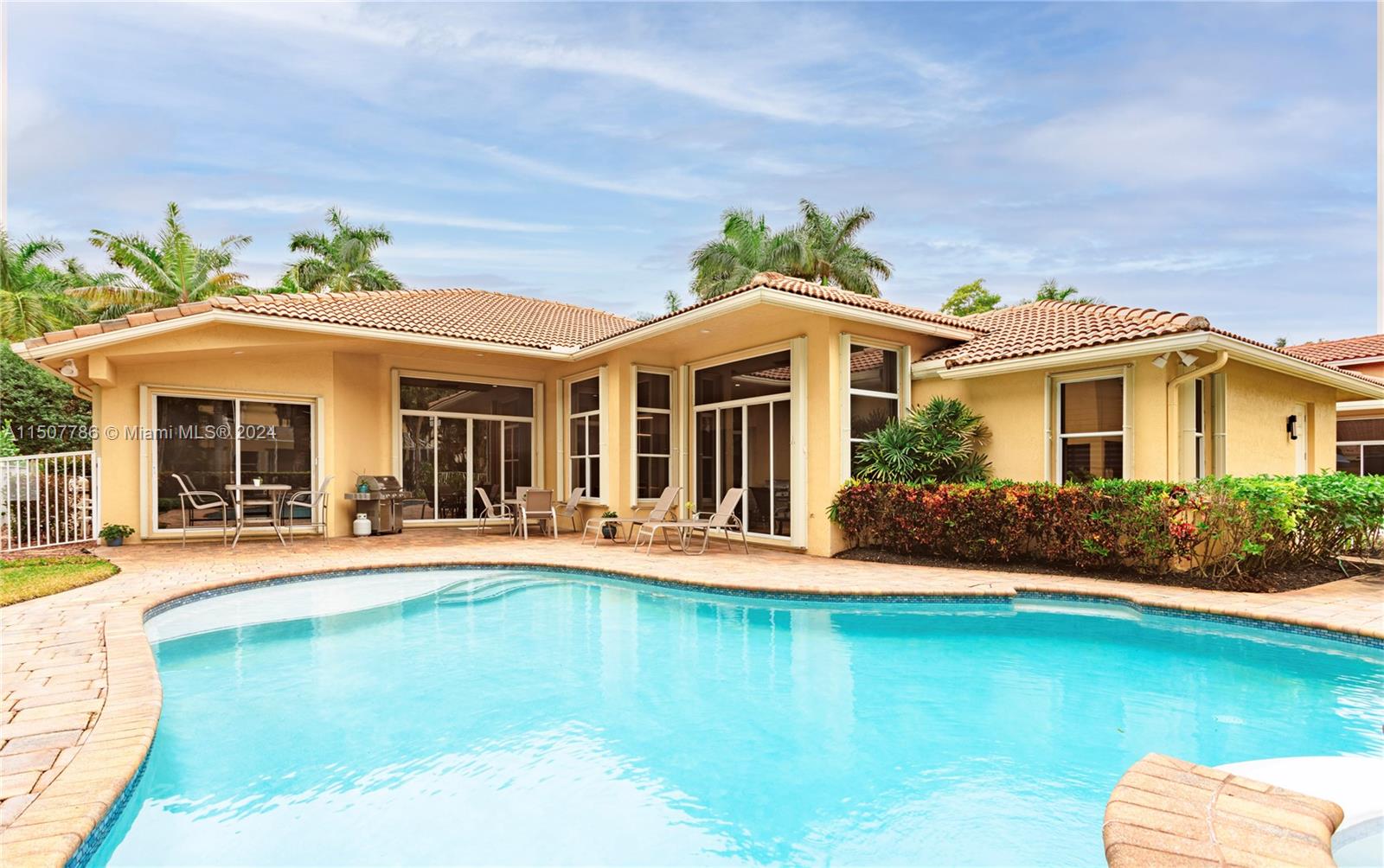 1655 Victoria Pointe Circle Weston, FL 33327 - Photo 4 of 43 front view of a house with a yard