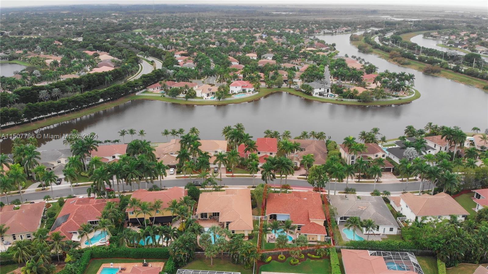 1655 Victoria Pointe Circle Weston, FL 33327 - Photo 5 of 43 an aerial view of residential houses with outdoor space and lake view