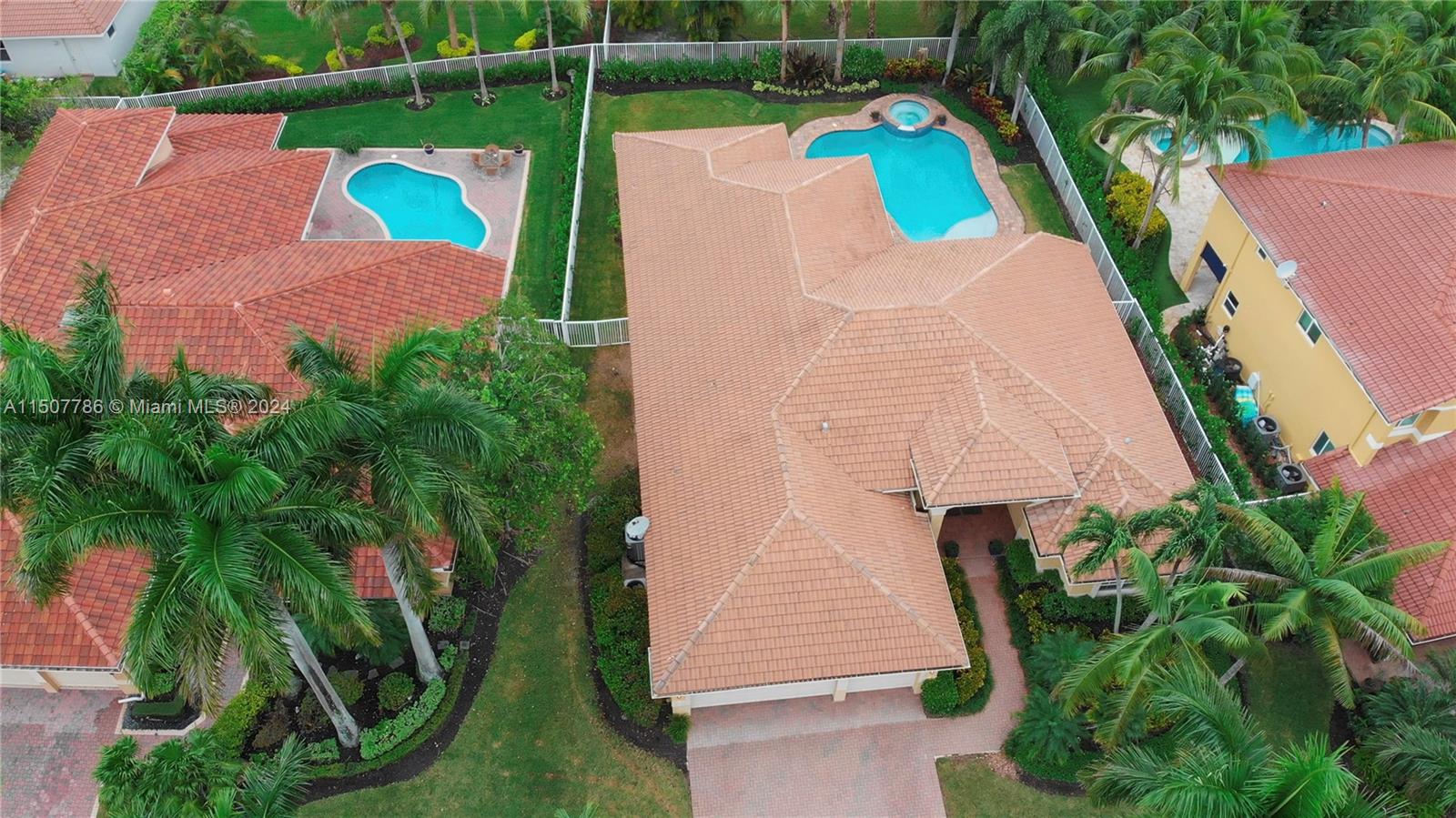1655 Victoria Pointe Circle Weston, FL 33327 - Photo 7 of 43 an aerial view of a house with a yard