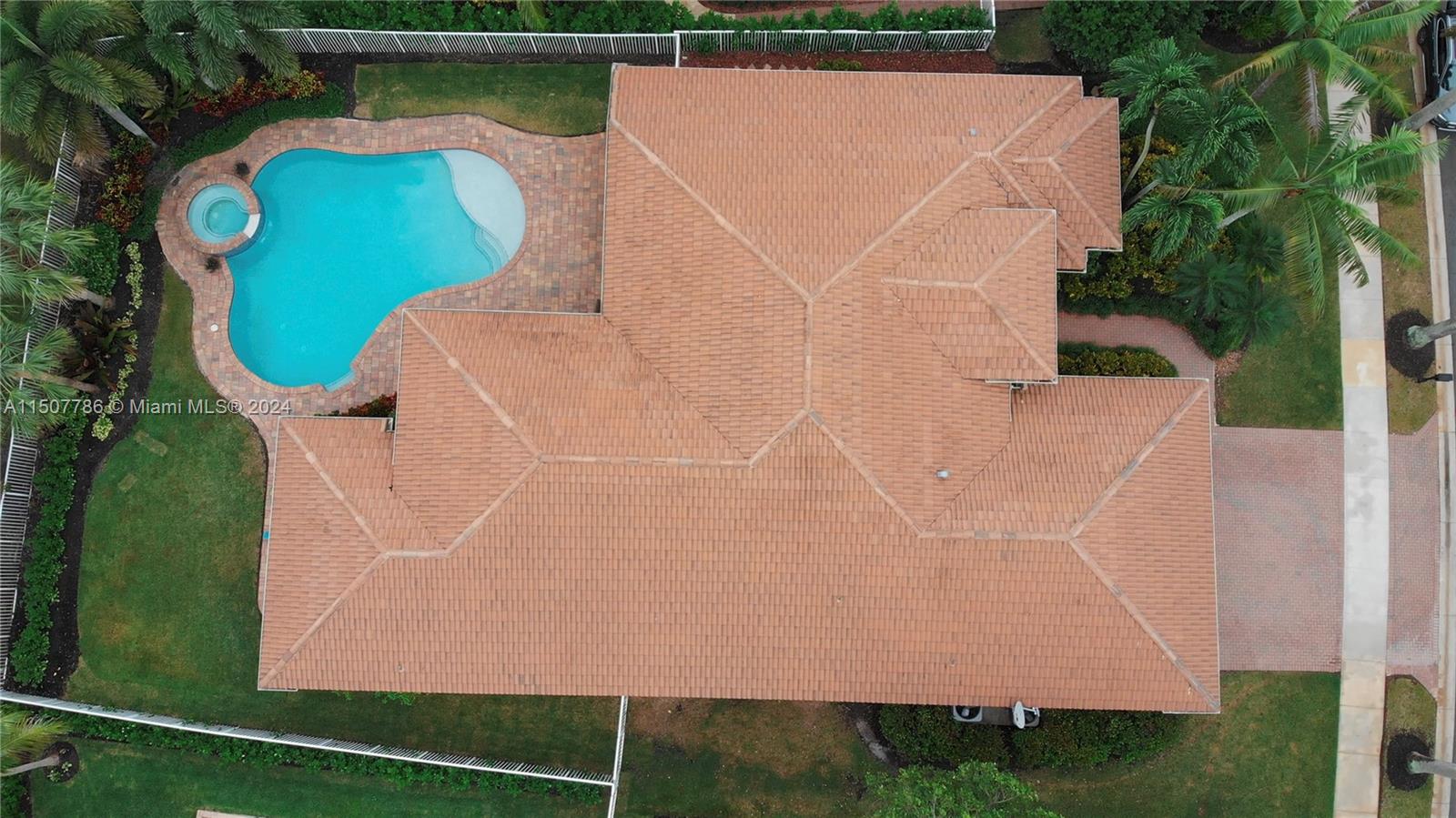 1655 Victoria Pointe Circle Weston, FL 33327 - Photo 8 of 43 an aerial view of a house with a yard and lake