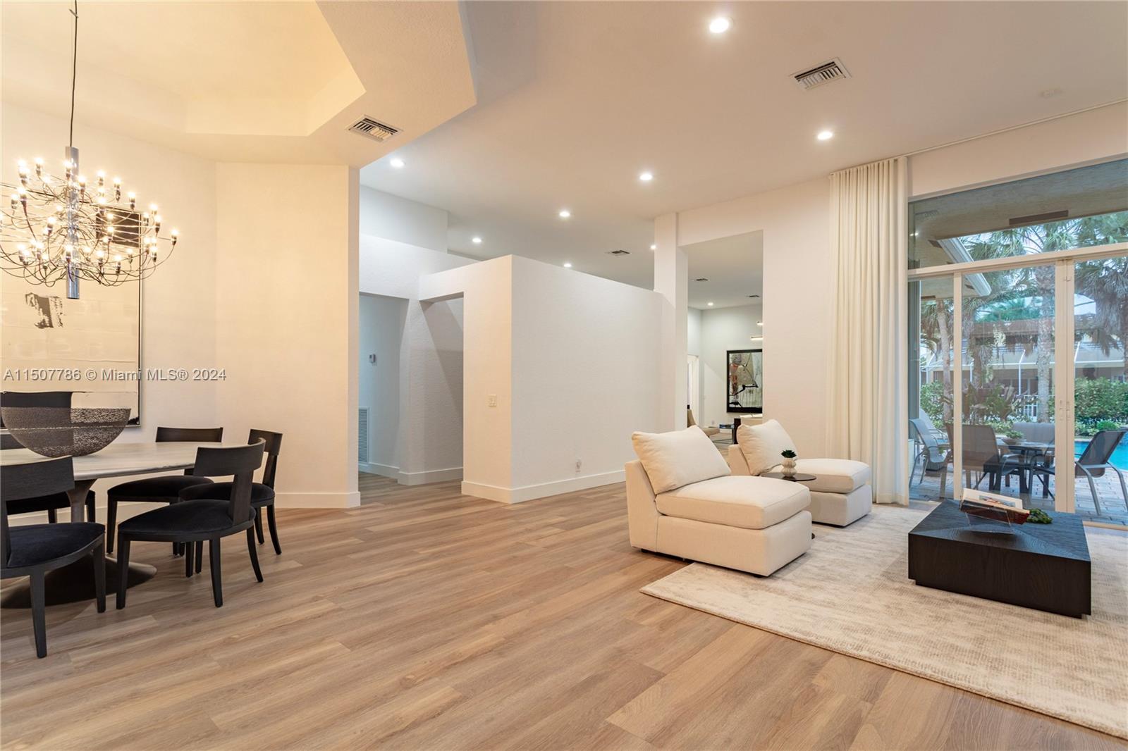 1655 Victoria Pointe Circle Weston, FL 33327 - Photo 9 of 43 a living room with furniture and wooden floor