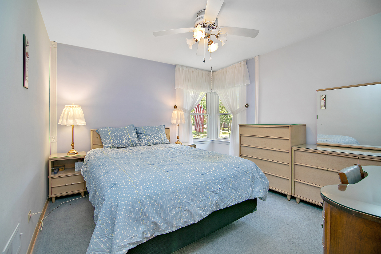 1707 Evergreen Road Homewood, IL 60430 - Photo 11 of 22 a spacious bedroom with a bed and a chandelier