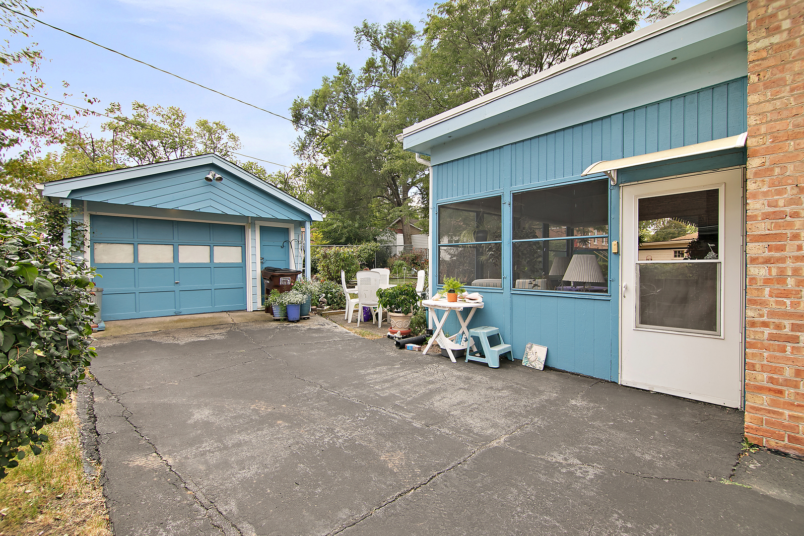 1707 Evergreen Road Homewood, IL 60430 - Photo 20 of 22 a front view of a house with a yard and seating space