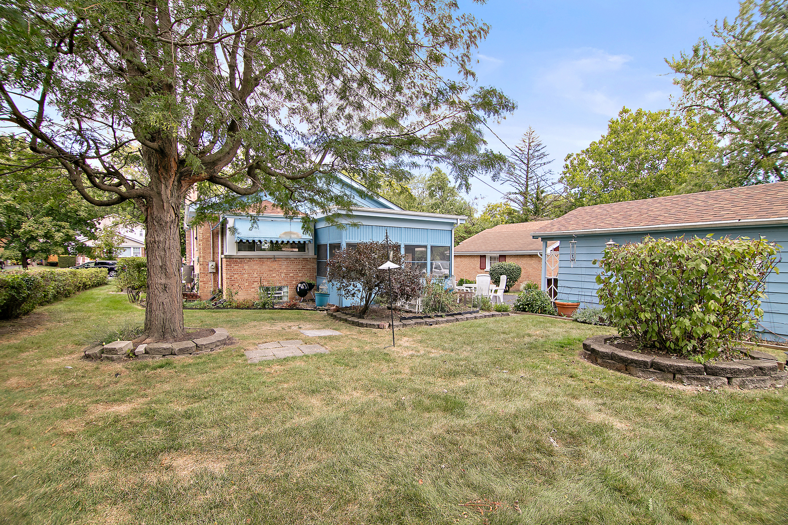 1707 Evergreen Road Homewood, IL 60430 - Photo 21 of 22 a view of a house with backyard and a tree