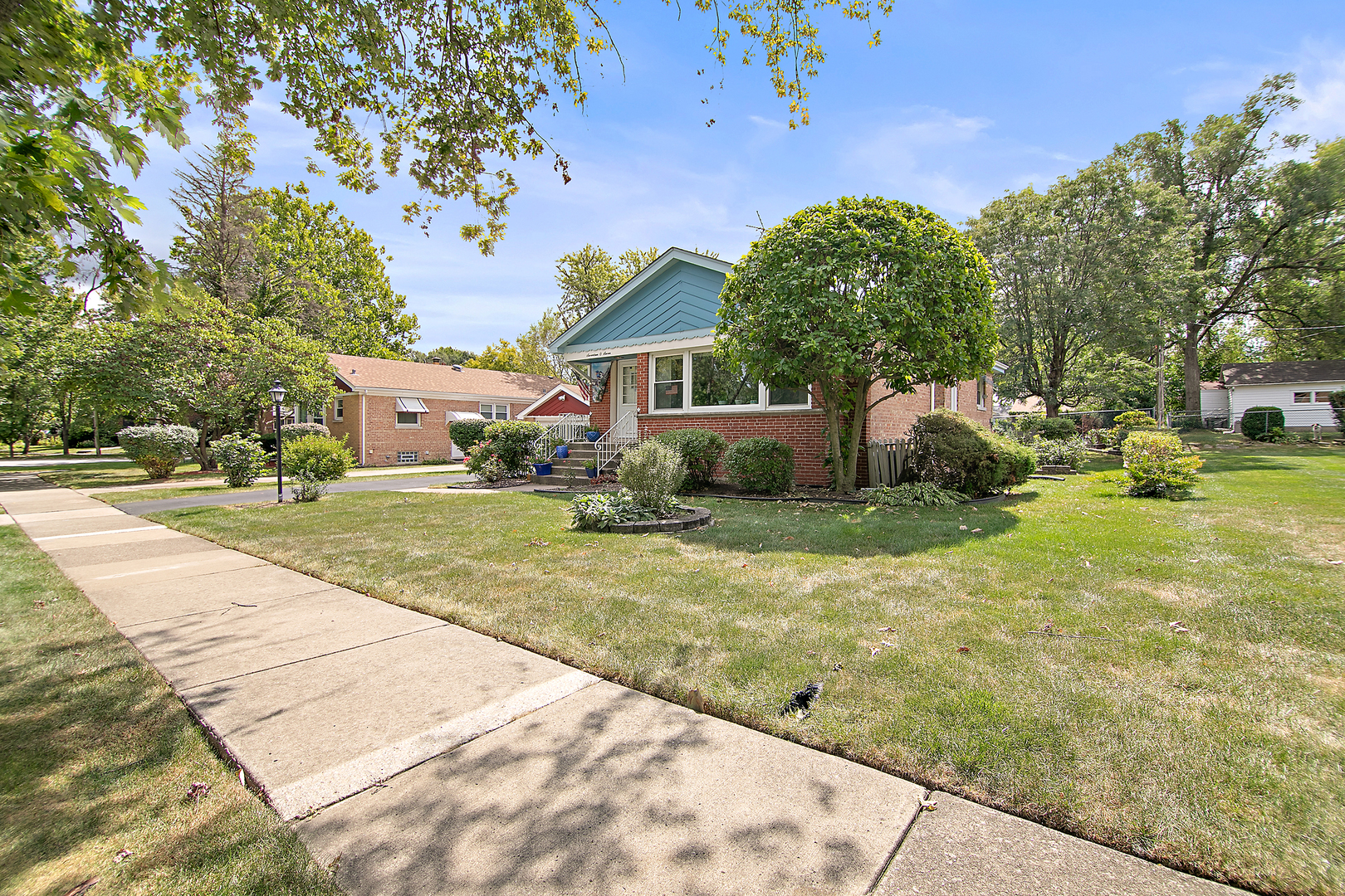 1707 Evergreen Road Homewood, IL 60430 - Photo 3 of 22 a house with garden in front of it
