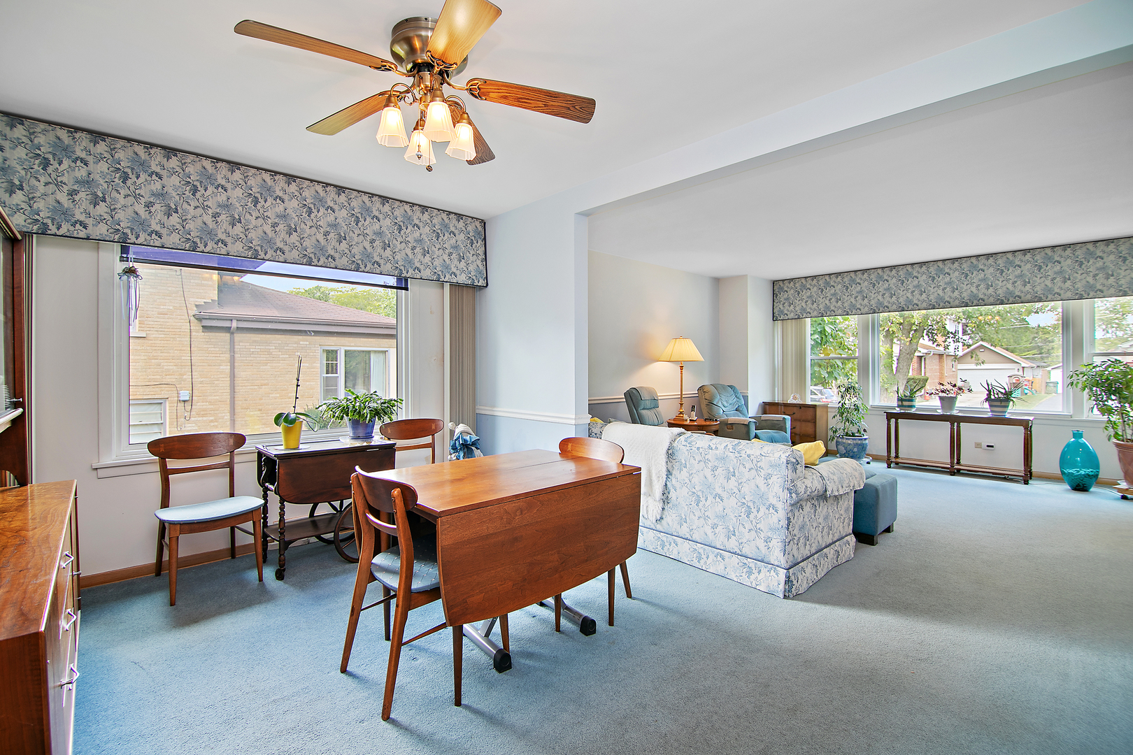 1707 Evergreen Road Homewood, IL 60430 - Photo 7 of 22 a living room with furniture a chandelier and a large window
