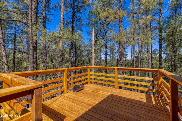 an aerial view of a houses with a yard