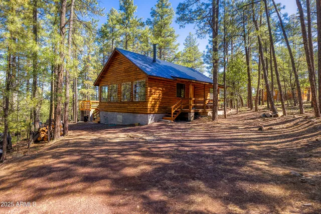 a wooden bench sitting in front of a house